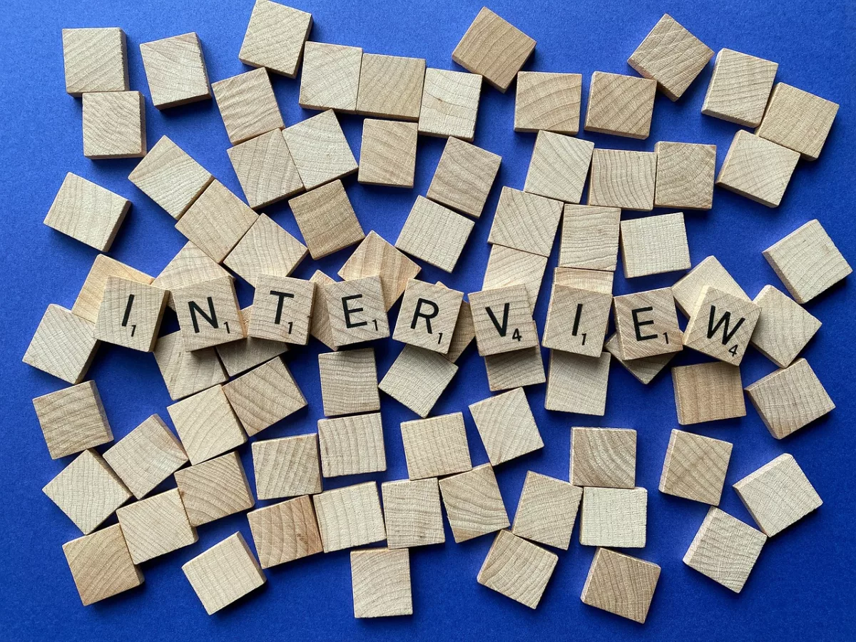 A photo of the word "interview" using Scrabble tiles.